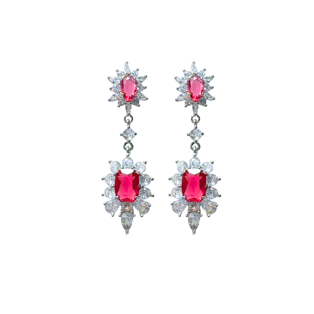 Pair of silver drop earrings featuring bright ruby red central gems framed by clear starburst cubic zirconia crystals.
