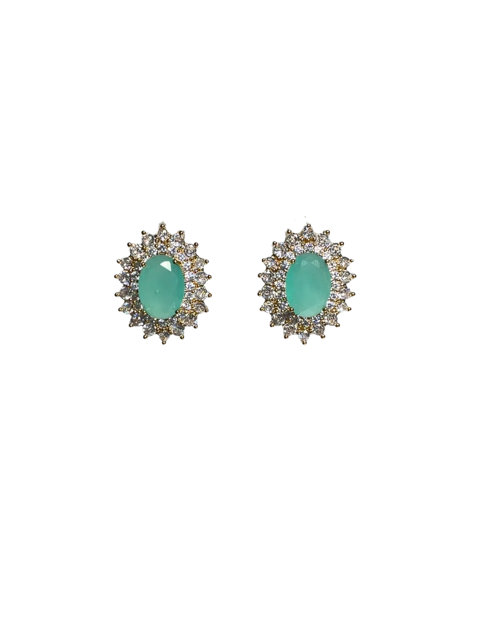 A pair of oval stud earrings featuring light green jade-like centers surrounded by small clear stones in a gold-tone halo setting, shown on a plain white background.