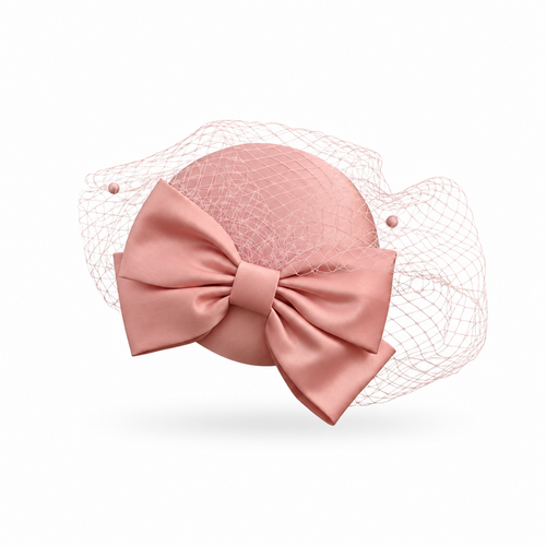 Blush pink satin pillbox fascinator hat with oversized satin bow and tonal birdcage veil – Victoria London