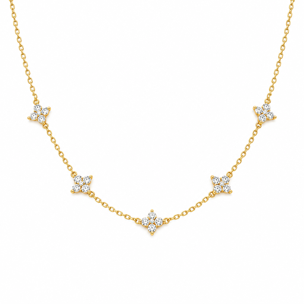 Delicate floral cluster station necklace in gold tone with crystal four-petal flowers on a fine chain – Victoria London