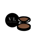 Skin Perfecting Bronzer in an open round black compact with warm brown powder beside its logo lid – Victoria London