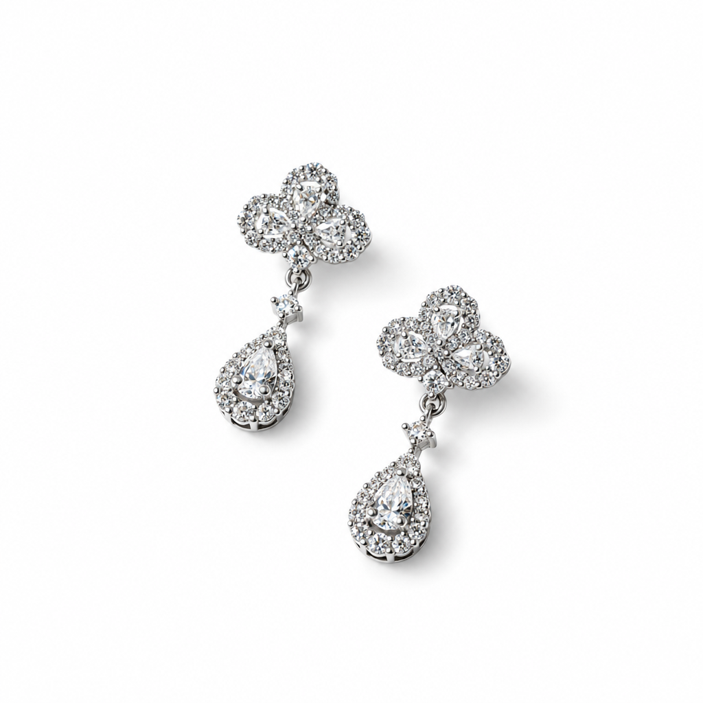 Heirloom teardrop statement earrings in silver tone, a pavé trefoil top above a pear-cut halo drop – Victoria London